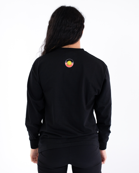 Clothing The Gaps. Black long sleeve T-shirt with Black, yellow and red 'always was always will be' text screen printed in centre.