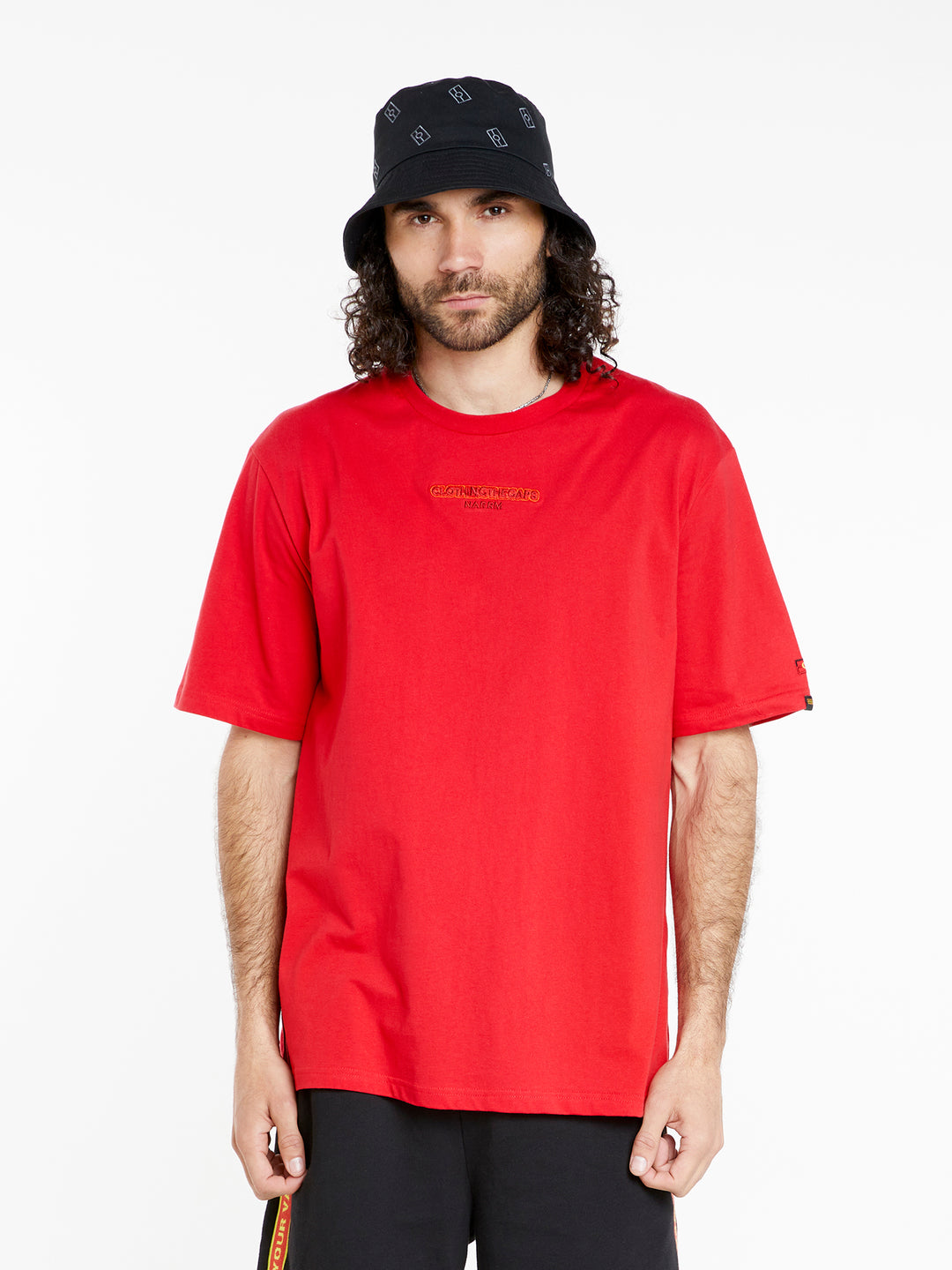 Clothing The Gaps. Land Tee. Red T-shirt. With embroidered 'Clothing The Gaps' on front chest with minimalist font in a contrasting light red colour and 'Narrm' in a dark red embroidered underneath, acknowledging the land on which Clothing The Gaps operates it's social enterprise.