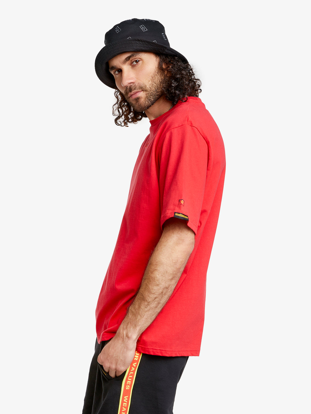 Clothing The Gaps. Land Tee. Red T-shirt. With embroidered 'Clothing The Gaps' on front chest with minimalist font in a contrasting light red colour and 'Narrm' in a dark red embroidered underneath, acknowledging the land on which Clothing The Gaps operates it's social enterprise.