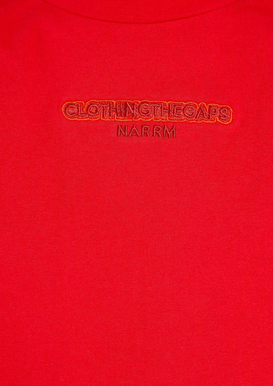 Clothing The Gaps. Land Tee. Red T-shirt. With embroidered 'Clothing The Gaps' on front chest with minimalist font in a contrasting light red colour and 'Narrm' in a dark red embroidered underneath, acknowledging the land on which Clothing The Gaps operates it's social enterprise.