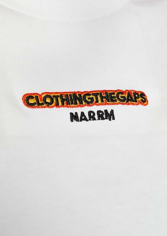 Clothing The Gaps. Spirit Tee. White T-shirt. With embroidered 'Clothing The Gaps' on front chest with minimalist font in black text with a yellow and red outline and 'Narrm' in black embroidered underneath, acknowledging the land on which Clothing The Gaps operates it's social enterprise.