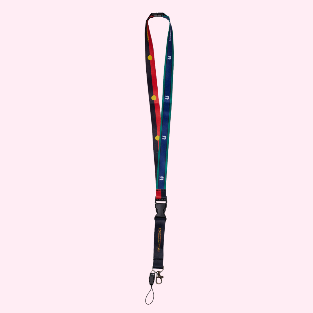 Clothing The Gaps. First Nations Flags Lanyard. Features both the coloured Aboriginal and Torres Strait Islander Flags with a black clip at back of neck and half way down to detach keys. At end of lanyard is a silver metal clip to attach what you would like.